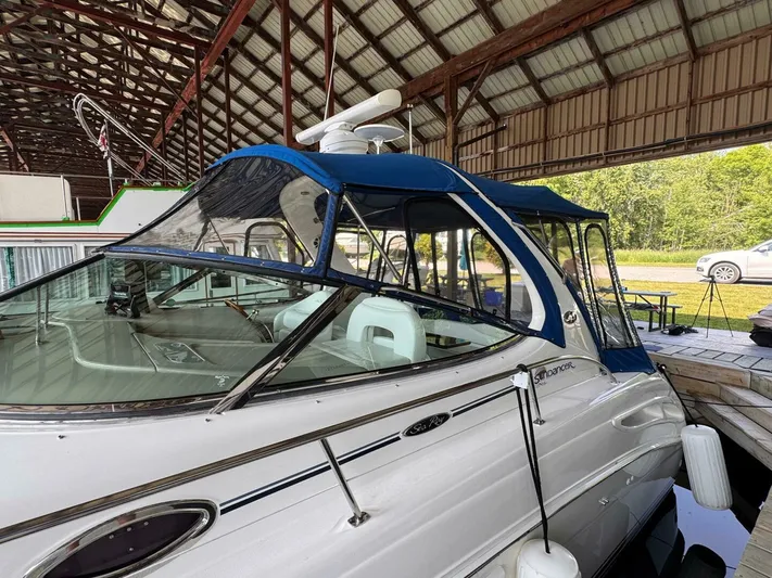  Yacht Photos Pics 2002 Sea Ray 360 Sundancer docked under a covered marina.