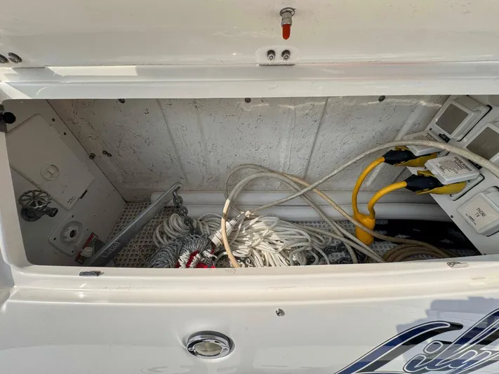  Yacht Photos Pics Storage compartment of a 2002 Sea Ray 360 Sundancer with ropes and cables.