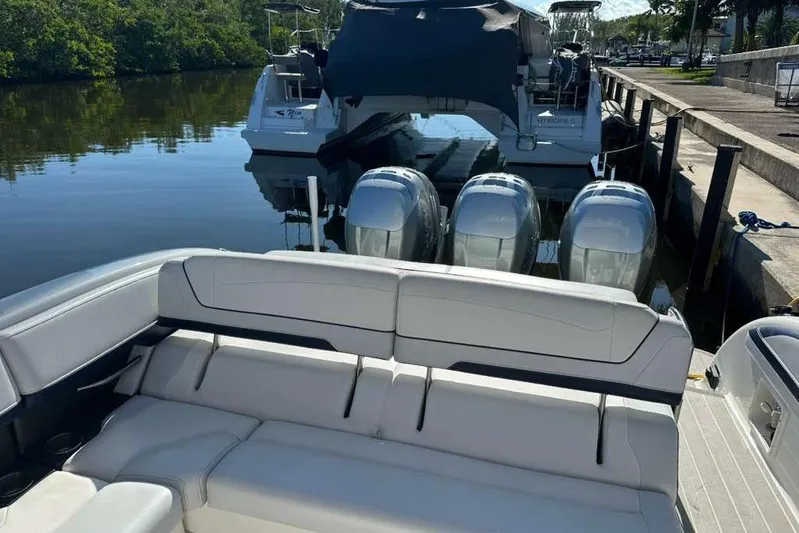  Yacht Photos Pics 2022 Formula 350 Crossover Bowrider OB docked, featuring spacious seating and powerful outboard engines.