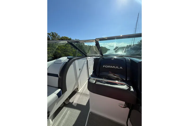  Yacht Photos Pics 2022 Formula 350 Crossover Bowrider OB interior with clear windshield and sunny view.