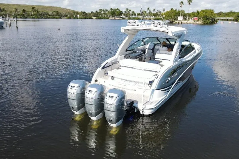  Yacht Photos Pics 2022 Formula 350 Crossover Bowrider OB with triple outboard engines on calm water.