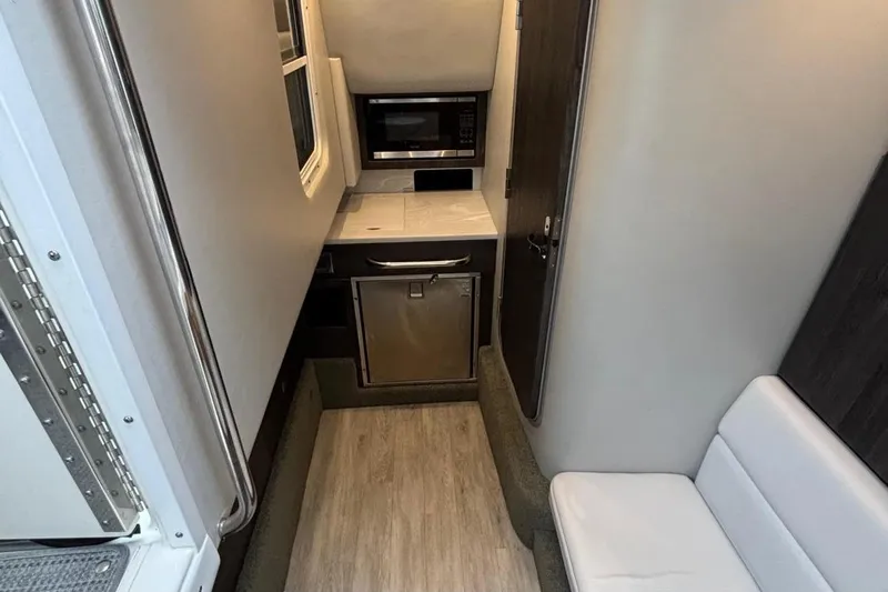  Yacht Photos Pics Interior of 2022 Formula 350 Crossover Bowrider OB, featuring compact kitchen area.