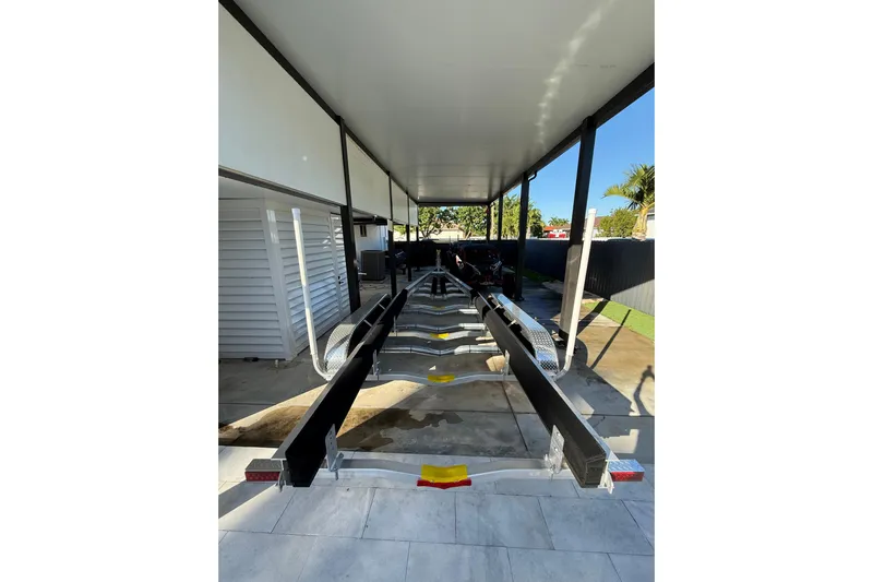  Yacht Photos Pics Covered storage area for a 2022 Formula 350 Crossover Bowrider OB boat trailer.