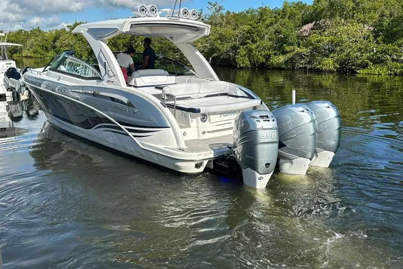  Yacht Photos Pics 2022 Formula 350 Crossover Bowrider OB with triple Mercury engines on water.