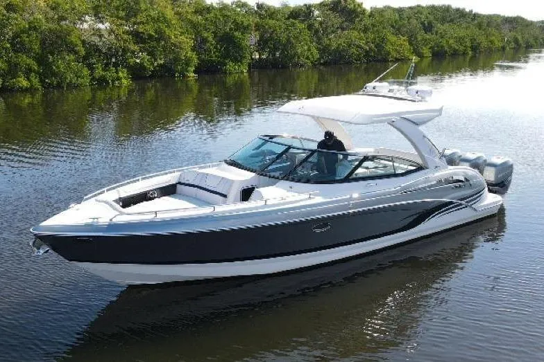  Yacht Photos Pics 2022 Formula 350 Crossover Bowrider OB cruising on a calm river.