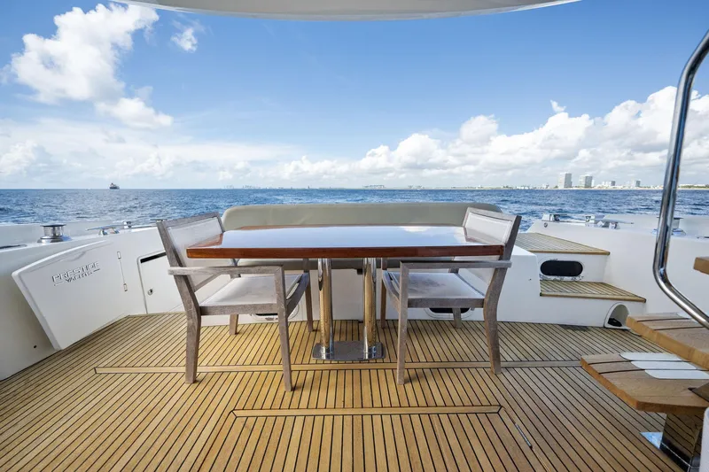 La Peque Yacht Photos Pics Prestige 620 yacht deck with dining area, ocean view, 2016 model.