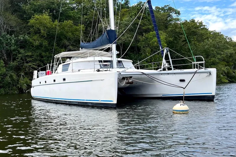 Destiny 2 Yacht Photos Pics Fountaine Pajot Belize 43 catamaran from 2000 anchored on a calm river.