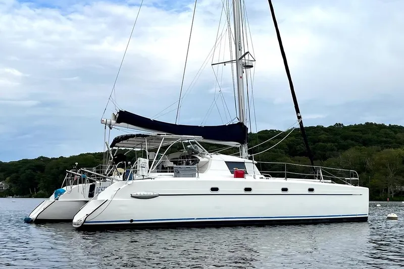 Destiny 2 Yacht Photos Pics Sailing catamaran Fountaine Pajot Belize 43, 2000 model, anchored on calm water.