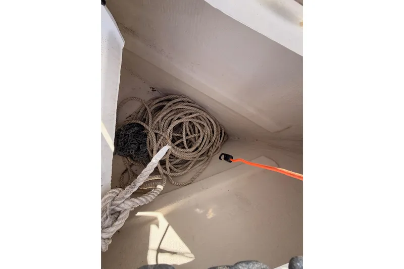 Parlay Yacht Photos Pics Coiled rope in storage compartment of 2003 Beneteau Oceanis Clipper 473 sailboat.