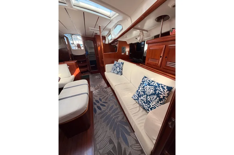 Parlay Yacht Photos Pics Luxurious interior of 2003 Beneteau Oceanis Clipper 473 yacht with elegant seating and decor.