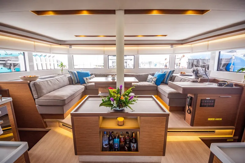 Scuba Doo Yacht Photos Pics Luxurious interior of 2020 Lagoon 50 yacht with elegant seating and modern decor.