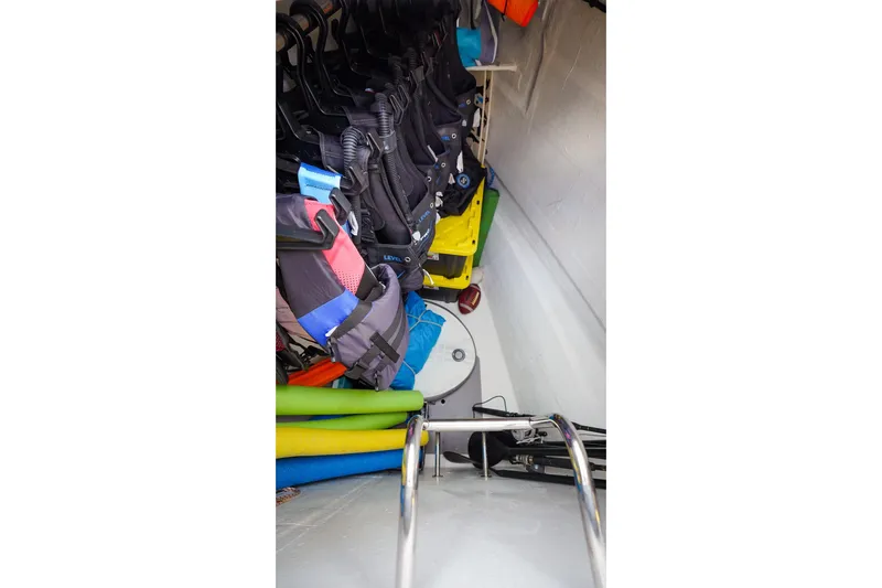 Scuba Doo Yacht Photos Pics Storage area on 2021 Lagoon 50 yacht with life jackets and pool noodles.
