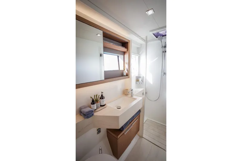 Scuba Doo Yacht Photos Pics Modern bathroom interior of 2021 Lagoon 50 yacht, featuring sleek design and amenities.