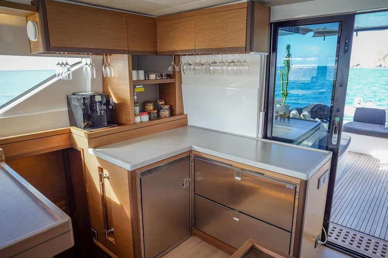 Scuba Doo Yacht Photos Pics Modern kitchen interior on 2021 Lagoon 50 yacht with ocean view.