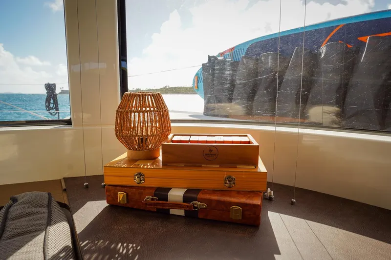 Scuba Doo Yacht Photos Pics Interior of 2021 Lagoon 50 yacht with decorative lamp and boxes, ocean view.