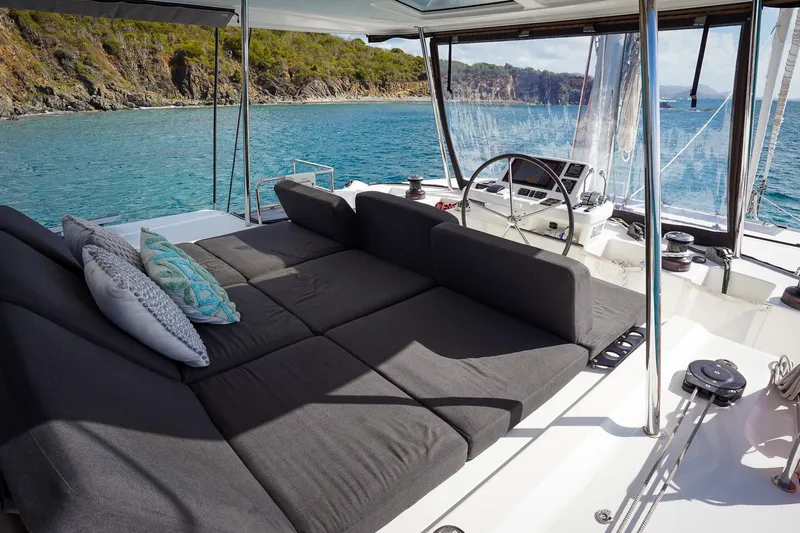 Scuba Doo Yacht Photos Pics Luxurious Lagoon 50 catamaran interior, 2021 model, with plush seating and scenic ocean view.