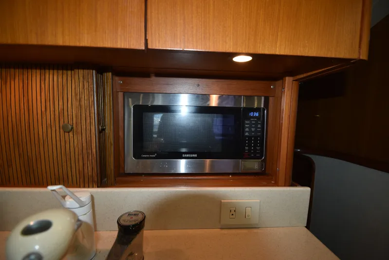 Whaler Yacht Photos Pics Microwave in the kitchen of a 1997 Ocean 48 Convertible yacht.