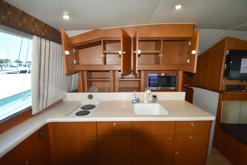 Whaler Yacht Photos Pics Kitchen area of the 1997 Ocean 48 Convertible yacht.