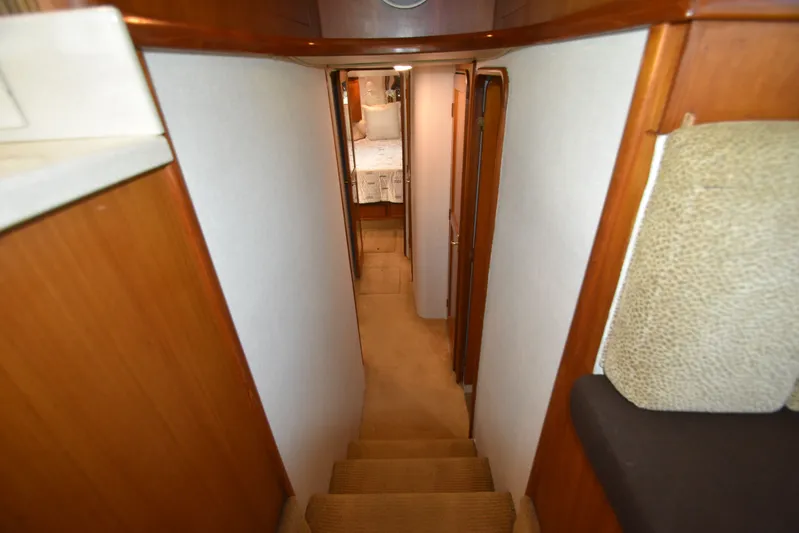 Whaler Yacht Photos Pics Interior of 1997 Ocean 48 Convertible yacht, featuring stairs and hallway.