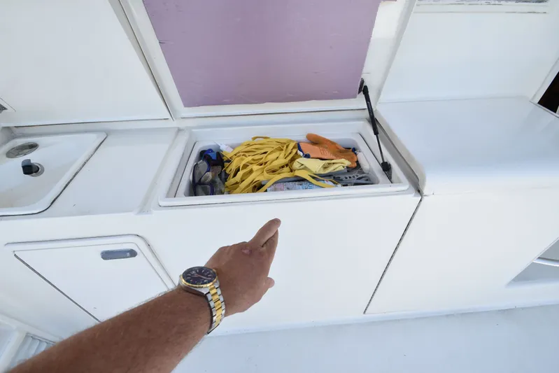 Whaler Yacht Photos Pics Storage compartment on a 1997 Ocean 48 Convertible boat.