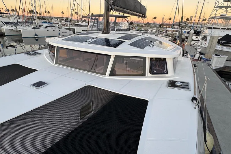 Keizan Yacht Photos Pics 2023 NEEL 43 trimaran docked at marina with solar panels on deck.