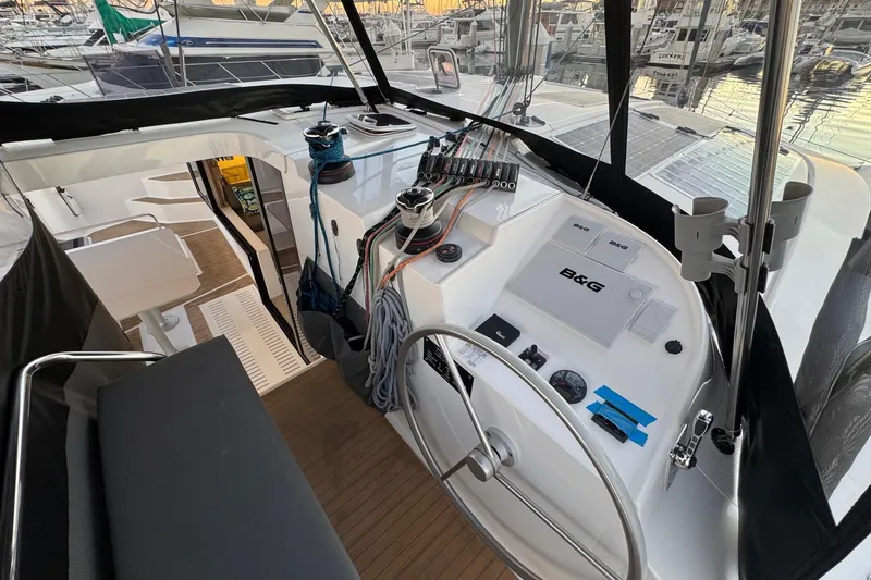 Keizan Yacht Photos Pics Cockpit of 2023 NEEL 43 trimaran with steering wheel and navigation equipment.