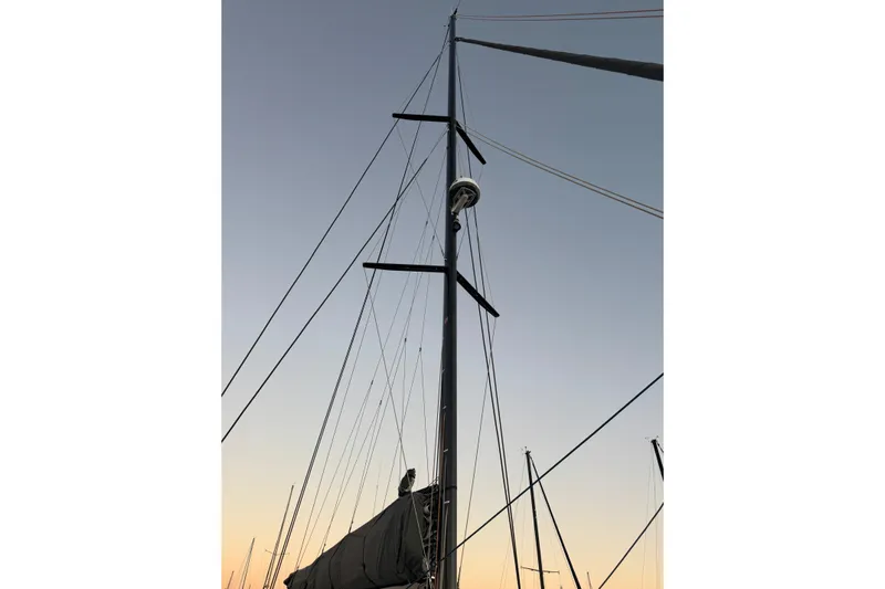 Keizan Yacht Photos Pics Mast of NEEL 43 sailboat against a sunset sky, 2023 model.