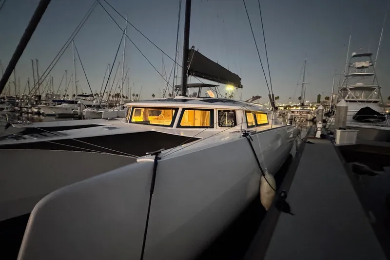 Keizan Yacht Photos Pics 2023 NEEL 43 trimaran docked at marina during evening.