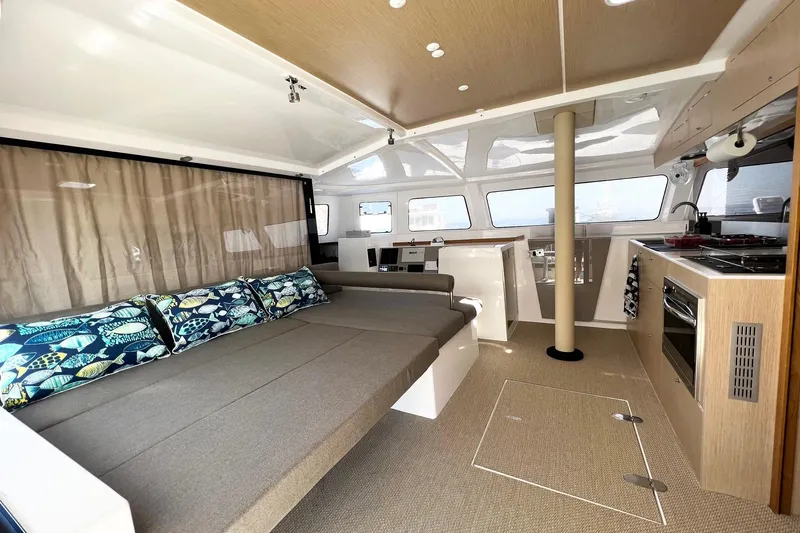 Keizan Yacht Photos Pics Modern NEEL 43 yacht interior with spacious seating, kitchen, and stylish decor, 2023 model.