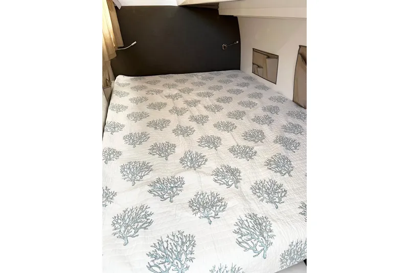 Keizan Yacht Photos Pics Cozy cabin bed with coral-patterned bedding in 2023 NEEL 43 model.