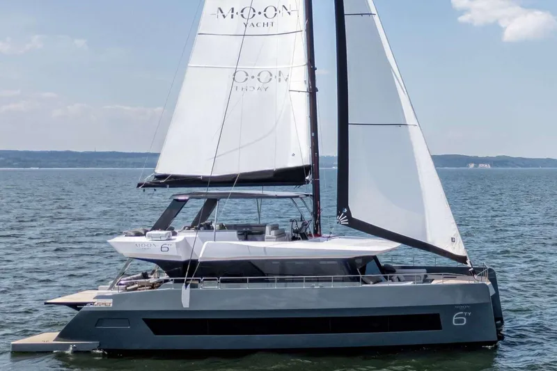  Yacht Photos Pics Luxury Moon 65 yacht sailing on open water, 2025 model.
