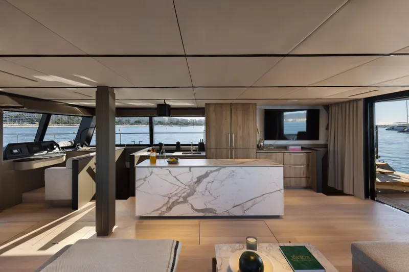 Yacht Photos Pics Luxurious interior of 2025 Moon 65 yacht with modern design and waterfront view.