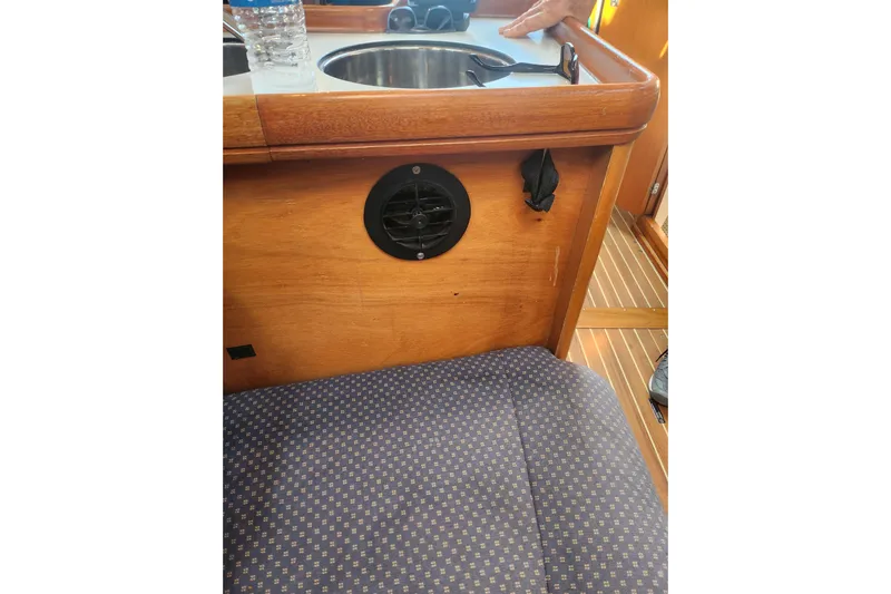 Runaway Yacht Photos Pics Interior of 2005 Elan 40 yacht with wooden cabinetry and seating.