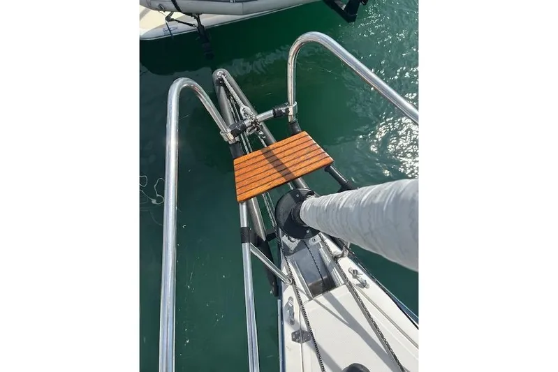 Runaway Yacht Photos Pics Bow of 2005 Elan 40 sailboat with stainless steel rails and wooden step.