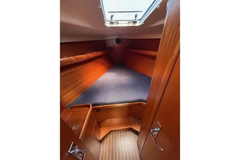 Runaway Yacht Photos Pics Cozy cabin interior of 2005 Elan 40 sailboat with wooden finish and skylight.