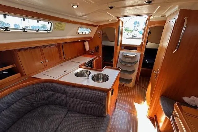 Runaway Yacht Photos Pics Luxurious interior of a 2005 Elan 40 yacht with wood finishes and modern amenities.