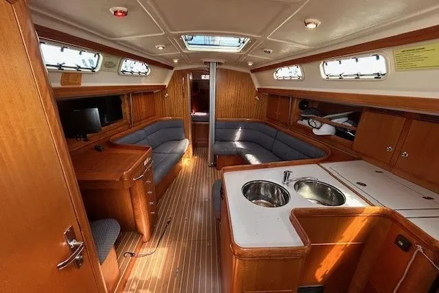 Runaway Yacht Photos Pics Interior of 2005 Elan 40 yacht with wood finish and modern amenities.