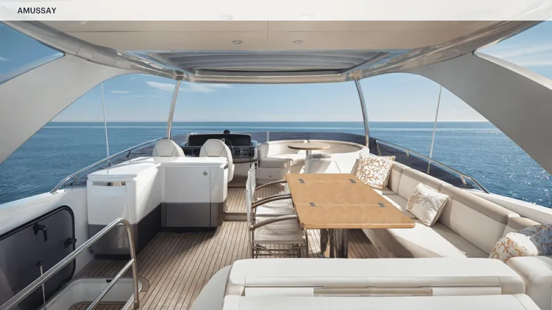 Amussay Yacht Photos Pics Luxurious 2020 Princess F62 yacht deck with elegant seating and ocean view.