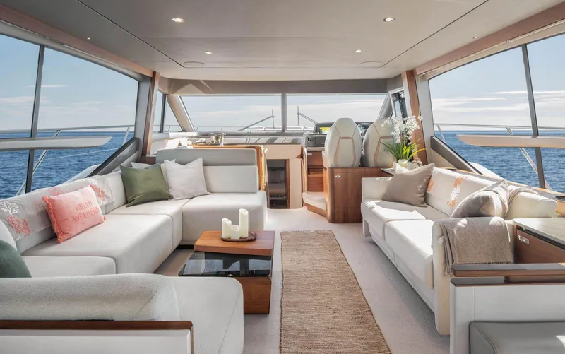 Amussay Yacht Photos Pics Luxurious interior of 2020 Princess F62 yacht with elegant seating and ocean view.