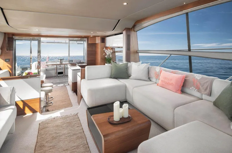 Amussay Yacht Photos Pics Luxurious interior of 2020 Princess F62 yacht with ocean view and modern furnishings.