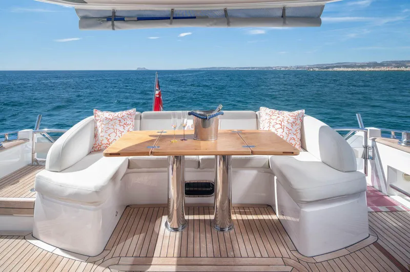 Amussay Yacht Photos Pics Luxury yacht Princess F62 deck with seating and table, ocean view, 2020 model.
