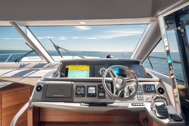 Amussay Yacht Photos Pics Helm of 2020 Princess F62 yacht with modern navigation equipment and ocean view.