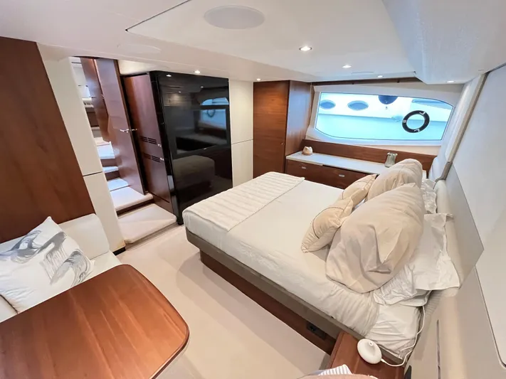 Amussay Yacht Photos Pics Luxurious 2020 Princess F62 yacht bedroom with modern design and elegant wood finishes.