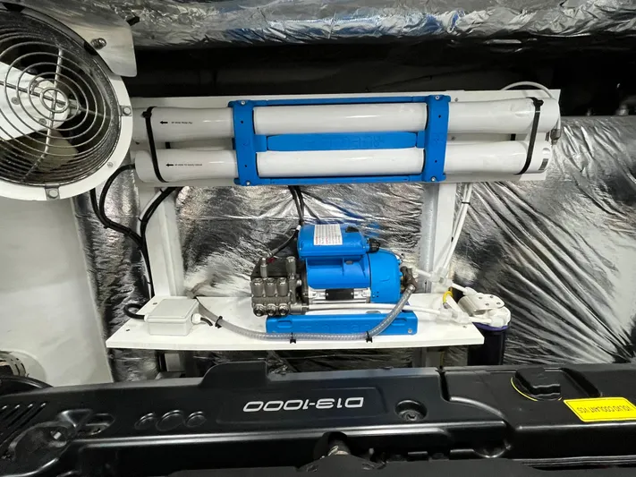 Amussay Yacht Photos Pics Engine room of 2020 Princess F62 yacht with water filtration system and fan.