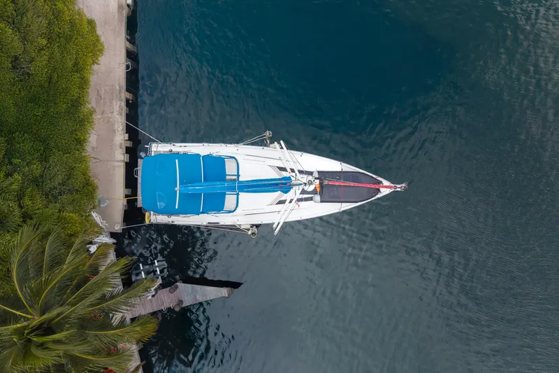 Siman H Yacht Photos Pics Aerial view of 2020 Beneteau Oceanis 46.1 yacht docked by lush greenery.