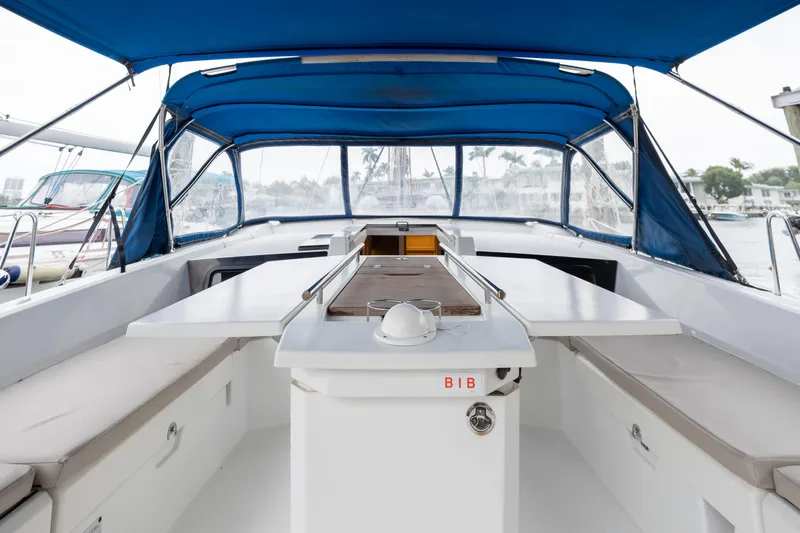 Siman H Yacht Photos Pics 2020 Beneteau Oceanis 46.1 yacht cockpit with blue canopy and seating area.