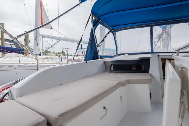 Siman H Yacht Photos Pics 2020 Beneteau Oceanis 46.1 yacht cockpit with blue canopy and comfortable seating.