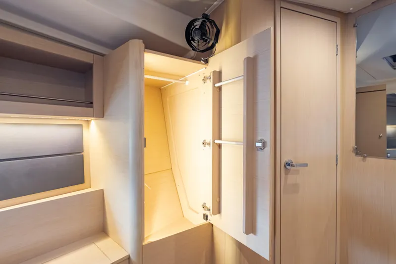 Siman H Yacht Photos Pics Interior of 2020 Beneteau Oceanis 46.1 yacht, featuring light wood cabinetry and storage space.