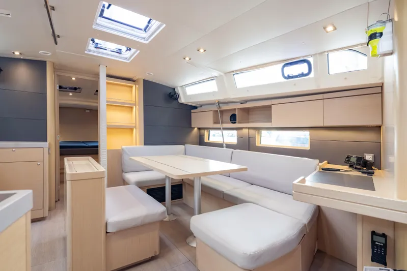 Siman H Yacht Photos Pics Luxurious interior of 2020 Beneteau Oceanis 46.1 yacht with modern seating and ample natural light.