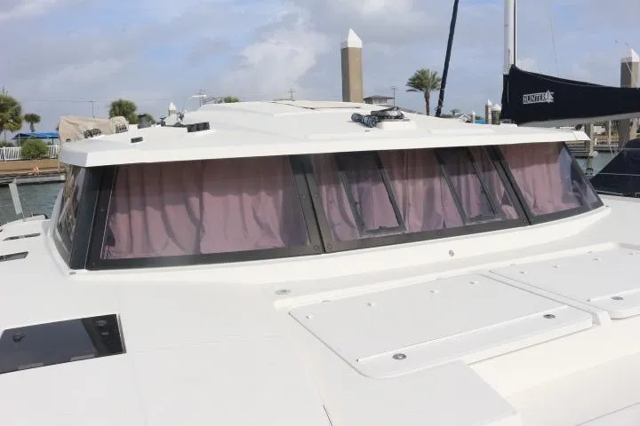 Cloud Nine Yacht Photos Pics 2020 Fountaine Pajot Astrea 42 Catamaran with tinted windows and sleek design.
